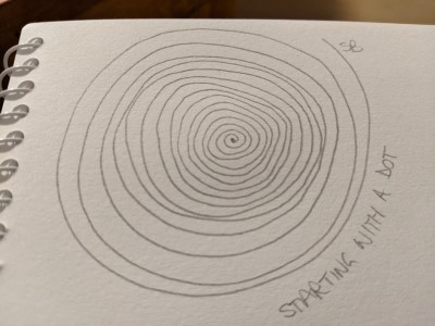 sketchbook drawing - starting with a dot - spiralling outwards from the dot in the centre