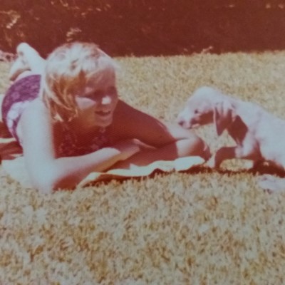 sunshine and puppies - Sandra Burns - 5 facts about me (post) - image: me at age ten with our weimaraner puppy Brutus